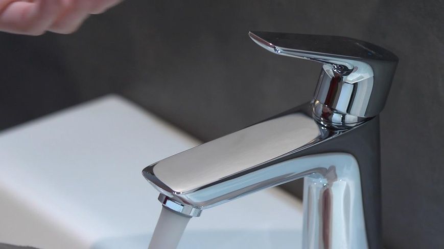 Змішувач для раковини зі зливним гарнітуром HANSGROHE TALIS E 71713000 61949 фото